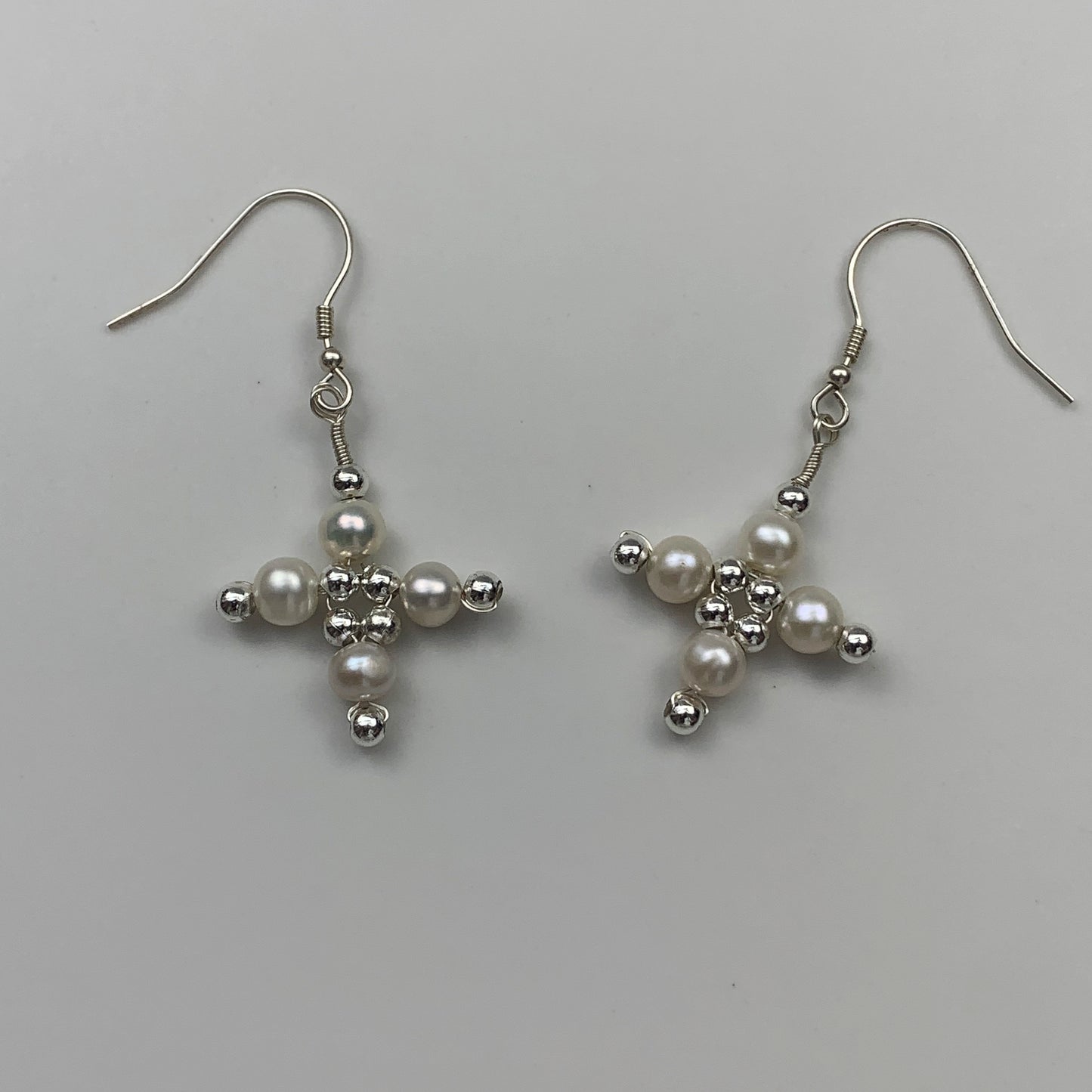 31. Cross pearl earrings