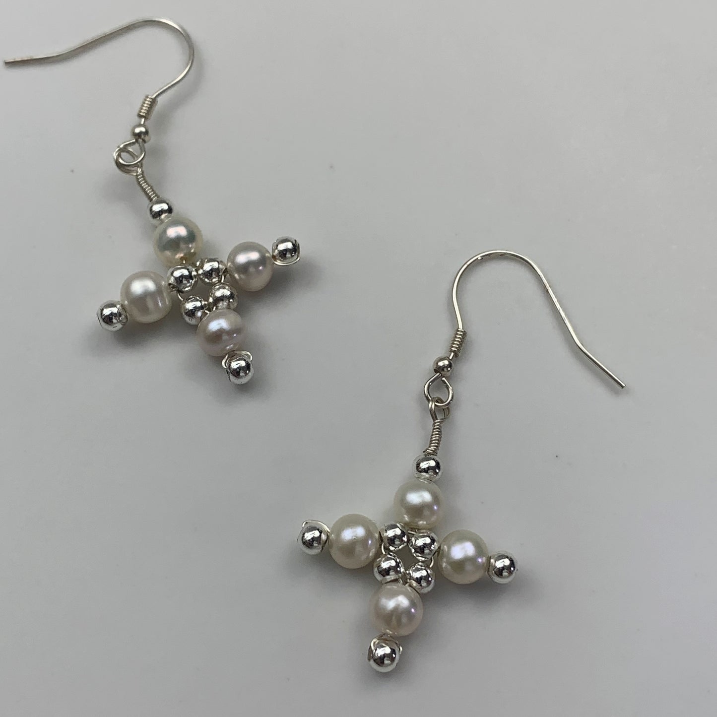 31. Cross pearl earrings